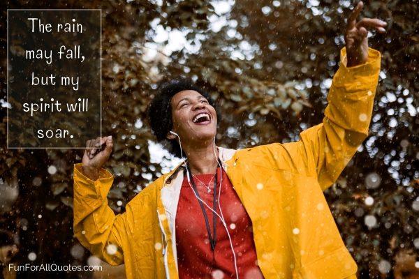 Woman wearing earphones happily dancing in the rain, with quote overlay