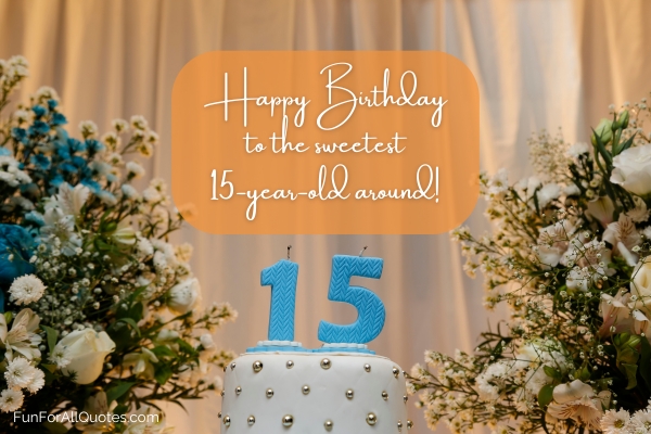 Birthday cake with the number '15' candles on top surrounded by white bouquets of flowers
