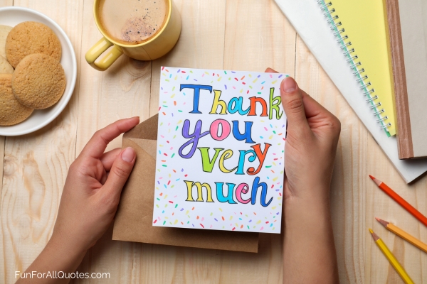 Someone holding a Thank You card